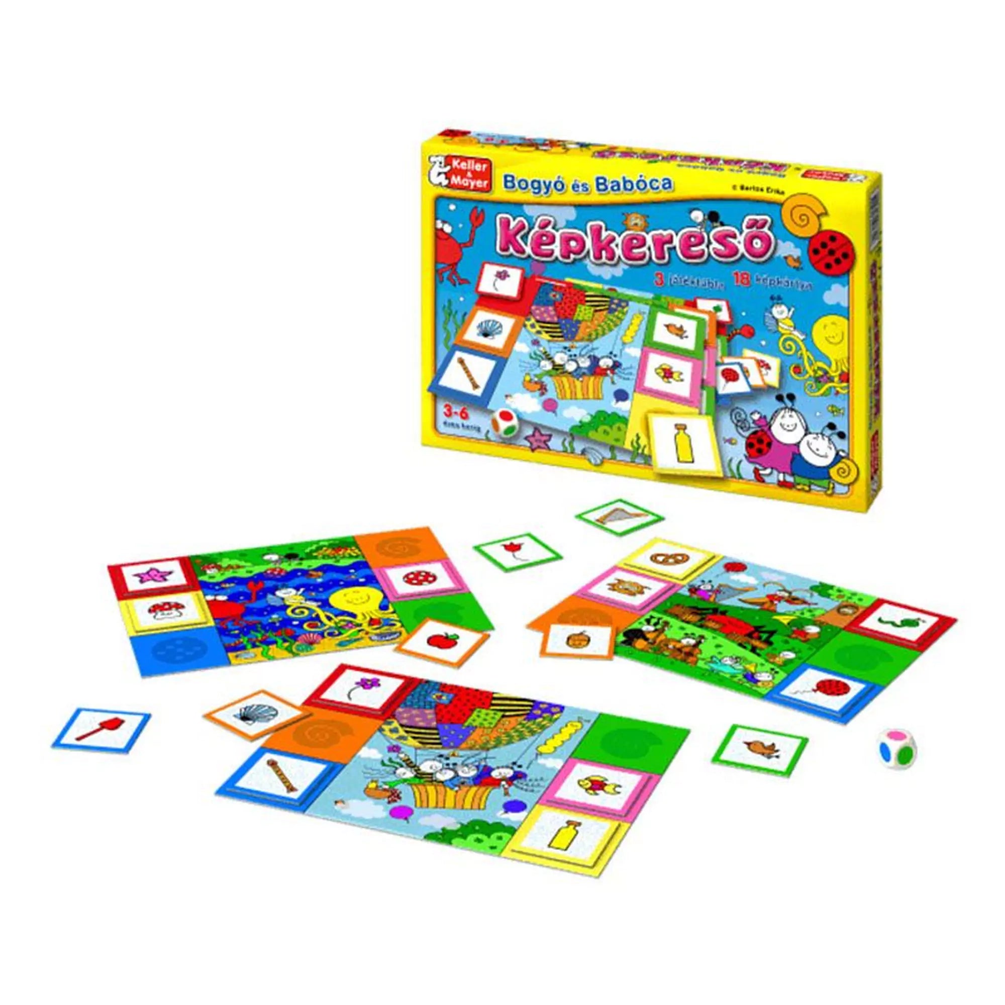 Színes játéktáblák, képkártyák, színdobókocka és a Bogyó és Babóca – Képkereső társasjáték doboza egy asztalon elrendezve, láthatóan a játék közbeni állapotban.