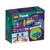 A LEGO Friends Homokfutó móka (41725) dobozának hátlapja, amely a készlet részletes tartalmát mutatja: a két minifigura, a jármű, a hullám és delfin elem, szörfdeszka, hűtőláda és számos kiegészítő, mint fagyi, banán és kutyaeledel. A jobb alsó sarokban „Learn to Build” felirat segíti a kezdő építőket.