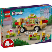 LEGO Friends Hot dog árus büfékocsi (42633) dobozkép színes városi háttérrel, a készlet elemeivel, Leo és Kaya karaktereivel, valamint 4+ korosztályi ajánlással.