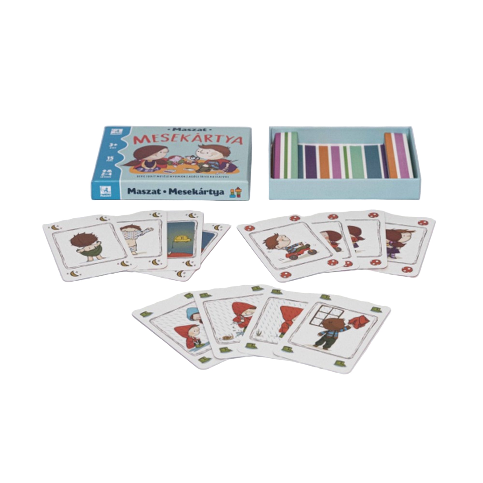 A Maszat Mesekártya társasjáték doboza és kártyái kiterítve. A kártyákon Maszat és barátai szerepelnek különböző mesés jelenetekben. A doboz mellett színes hátú kártyák és illusztrált lapok láthatók.