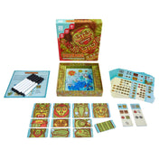 A Totemix társasjáték kibontva, láthatók a kártyák, kristály jelölők, törölhető táblák, filcek és a nyitott doboz belső mintázata.