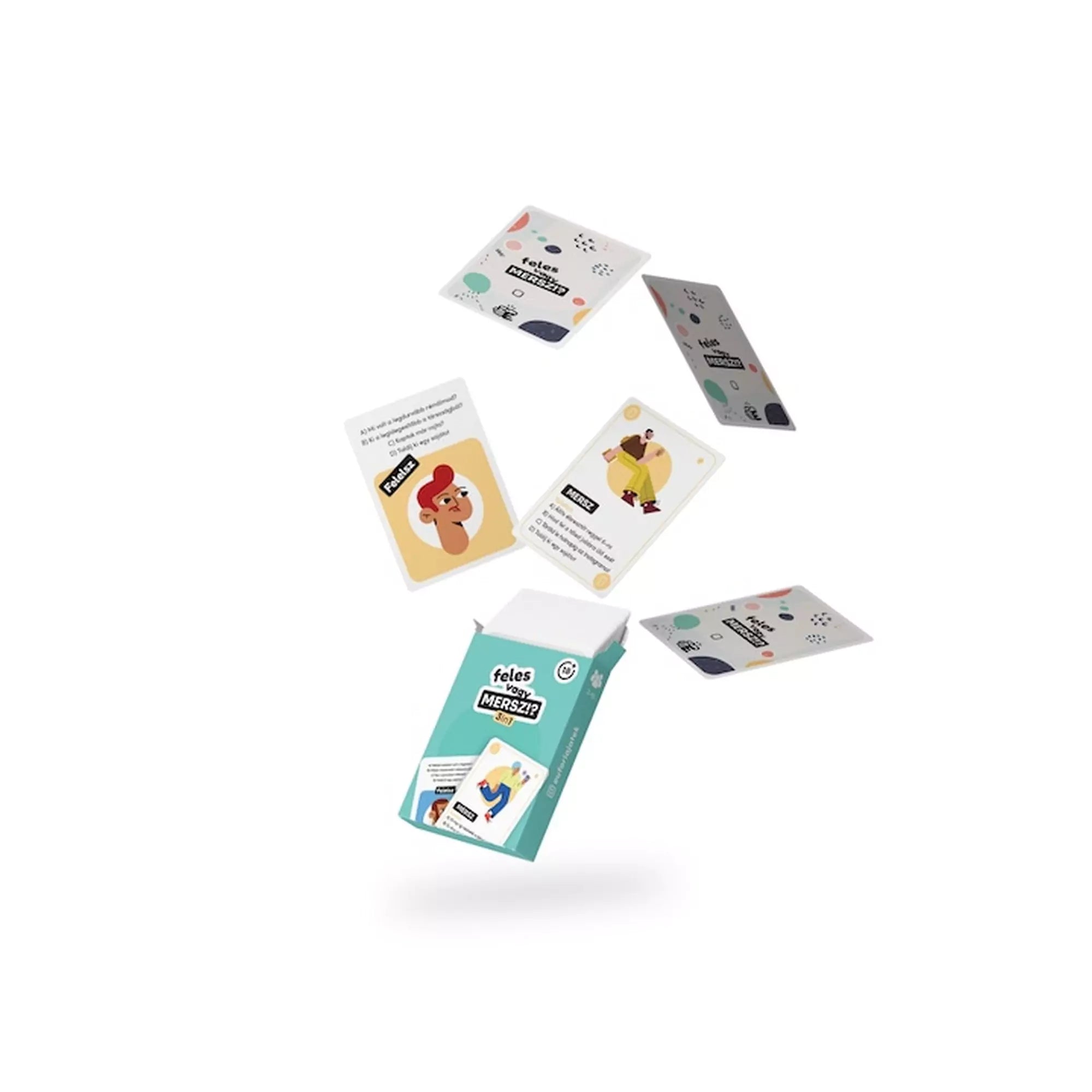 Feles vagy Mersz?! társasjáték színes kártyái a levegőben, a nyitott doboz mellett.