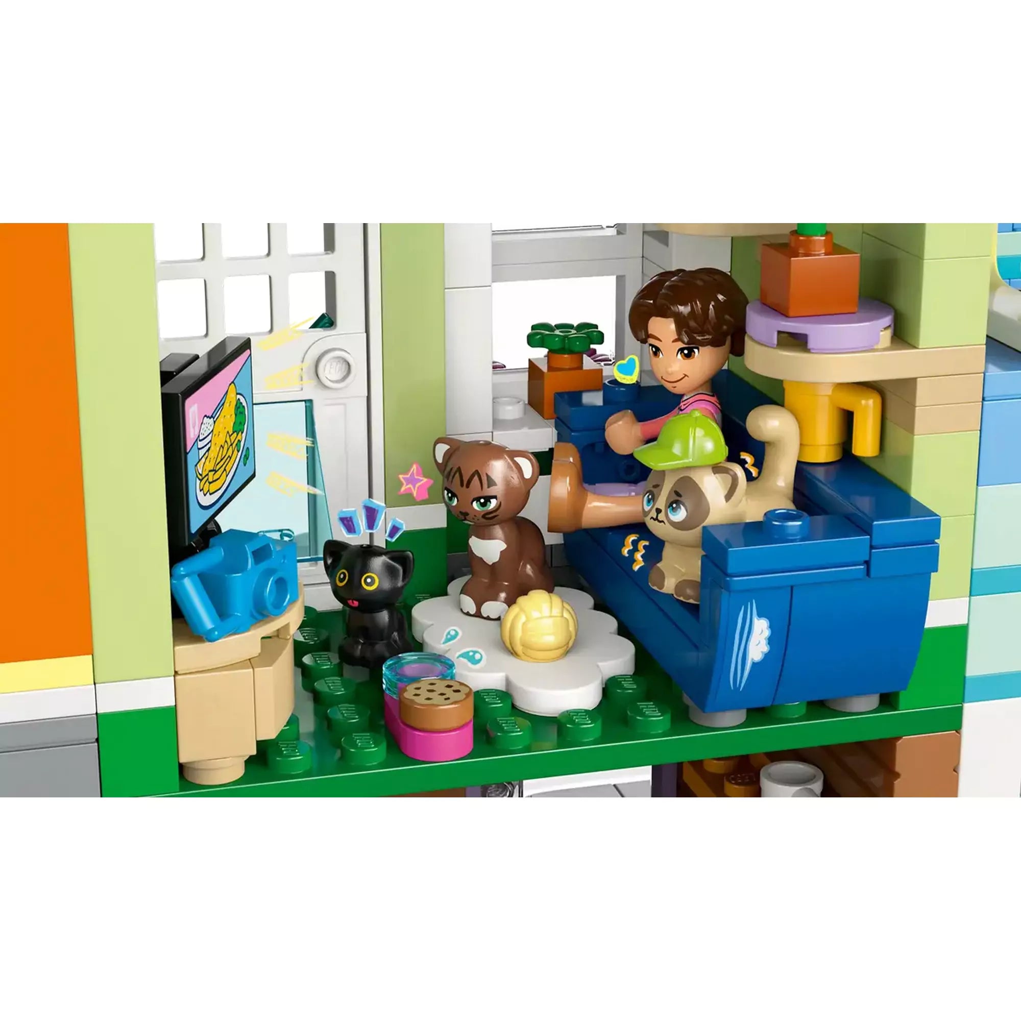 LEGO Friends Heartlake City lakások és üzletek 42670 egyik lakása cicás részlettel és kényelmes nappalival.