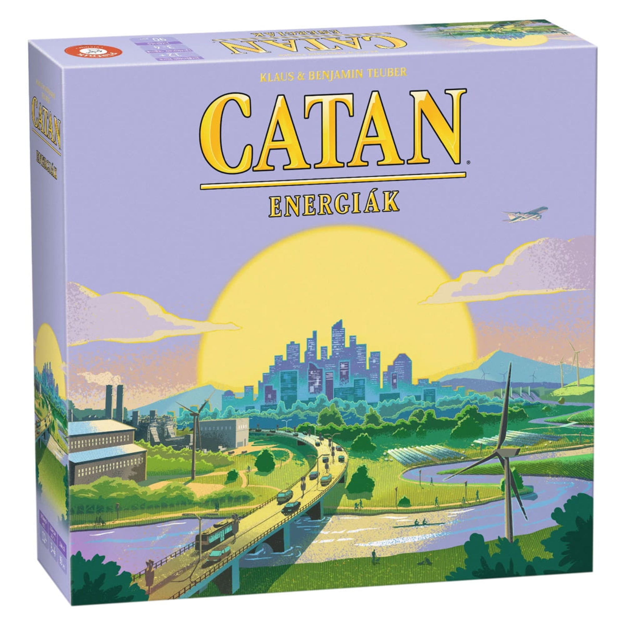 A képen a "Catan: Energiák" társasjáték indigo színű doboza látható. A doboz borítóján egy modern városképet látunk, amely szélkerékkel, napelemekkel és ipari létesítményekkel van díszítve, ezzel utalva a fenntartható energiákra.