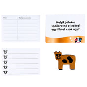 Csorda Szellem – Műüzik és Mozik társasjáték kérdéskártyái és Arany Marha figura felülnézetben.