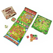 A Garden Rush társasjáték teljes játékképe az asztalon: hosszú játéktábla mezőkkel, pontozótábla, zöldséglapkák és zsák az alkatrészekkel.