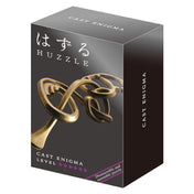 A Huzzle Cast Enigma ördöglakat elegáns, fekete dobozban, amelyen a játék összefonódó, bronzszínű elemei láthatók.