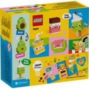LEGO Classic Ételek kreatív építőjáték dobozának hátoldala – különböző mosolygós ételeket bemutató modellek, például avokádó, tea, zöld fagyi, görögdinnye, valamint szabad építési ötletek és színes LEGO elemek.