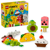 LEGO Classic Alkotóelemek készlet vidám ételekkel – a képen egy színes LEGO készlet látható, amely tartalmaz egy mosolygós avokádót, egy fagyit, egy muffint gyertyával és egy tacót, valamint építőelemeket és dekorációkat különböző kreatív alkotásokhoz.