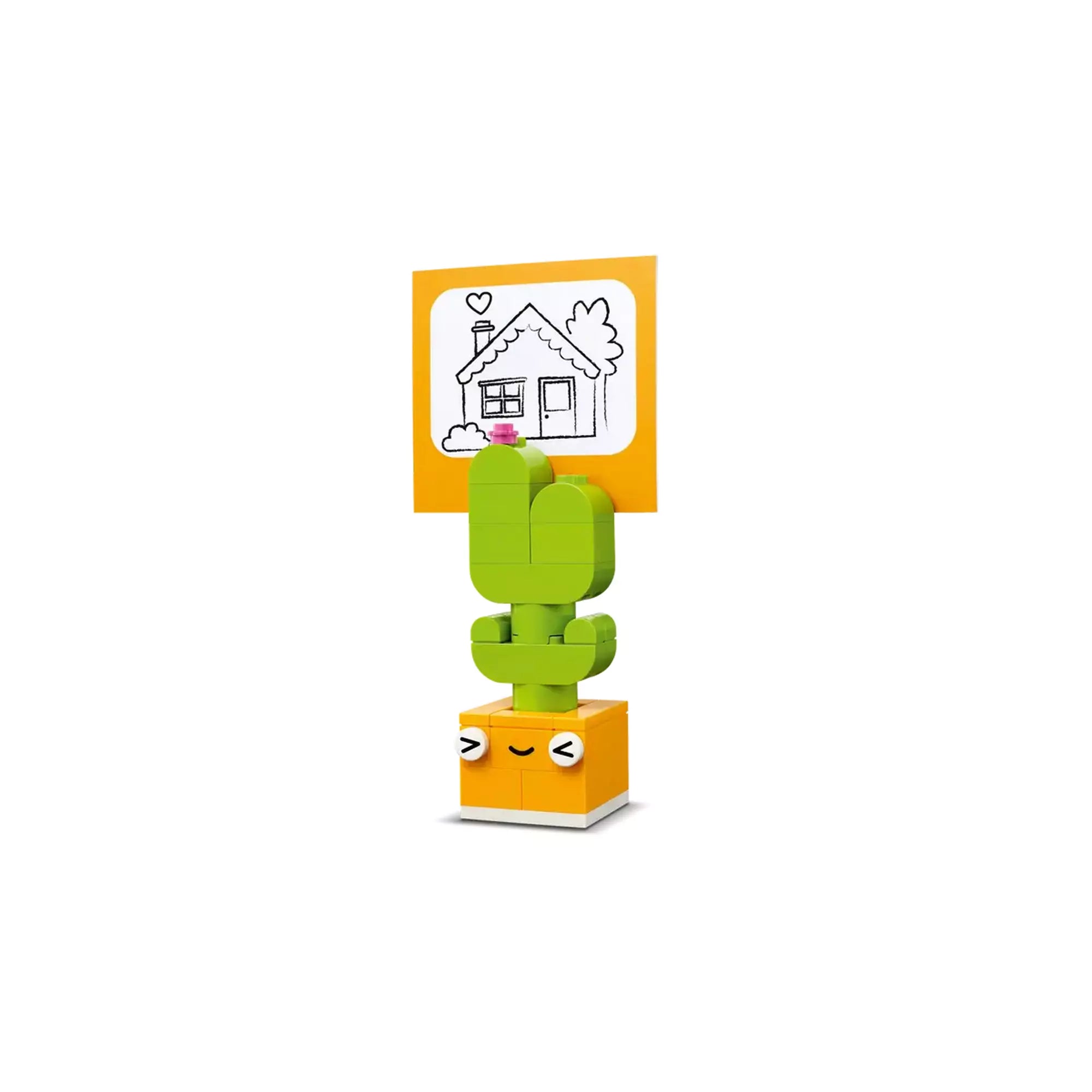 LEGO Classic Kreatív vidámságdoboz (11042) készletből készült aranyos LEGO kaktusz modell, amelyen egy házikós rajz van elhelyezve.