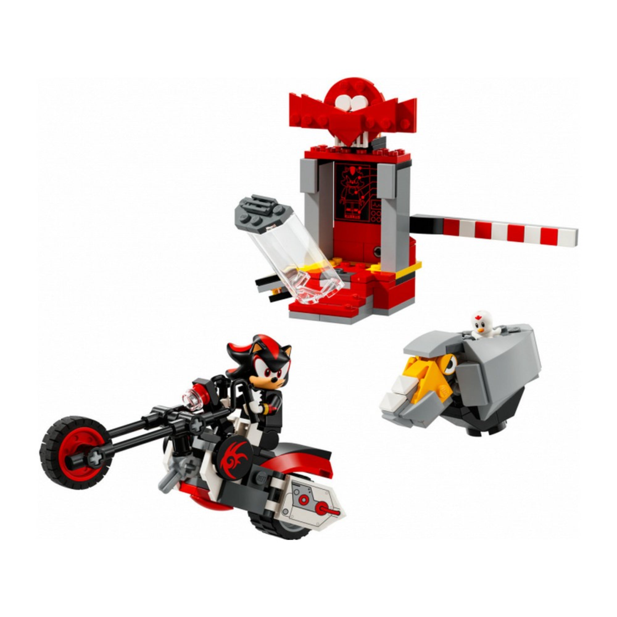 Ez a kép a LEGO Sonic the Hedgehog – Shadow’s Escape (76995) készlet elemeit mutatja kibontva és közelebbről. A bal alsó sarokban Shadow, a fekete süni egy vagány, fekete-piros színű motoron száguld. A háttérben egy piros-szürke kapszula látható áttetsző ajtóval, amelyből Shadow éppen kiszabadult. A kép jobb oldalán egy robotpatkány tűnik fel, amelyiknek a hátán egy kis fehér robotfigura (valószínűleg egy vezérlőegység) foglal helyet. 