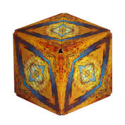 Első kép: A Shashibo: Savanna mágneses kocka hatszög formában, sárga, narancs és kék színekben, absztrakt, afrikai tájat idéző mintával.