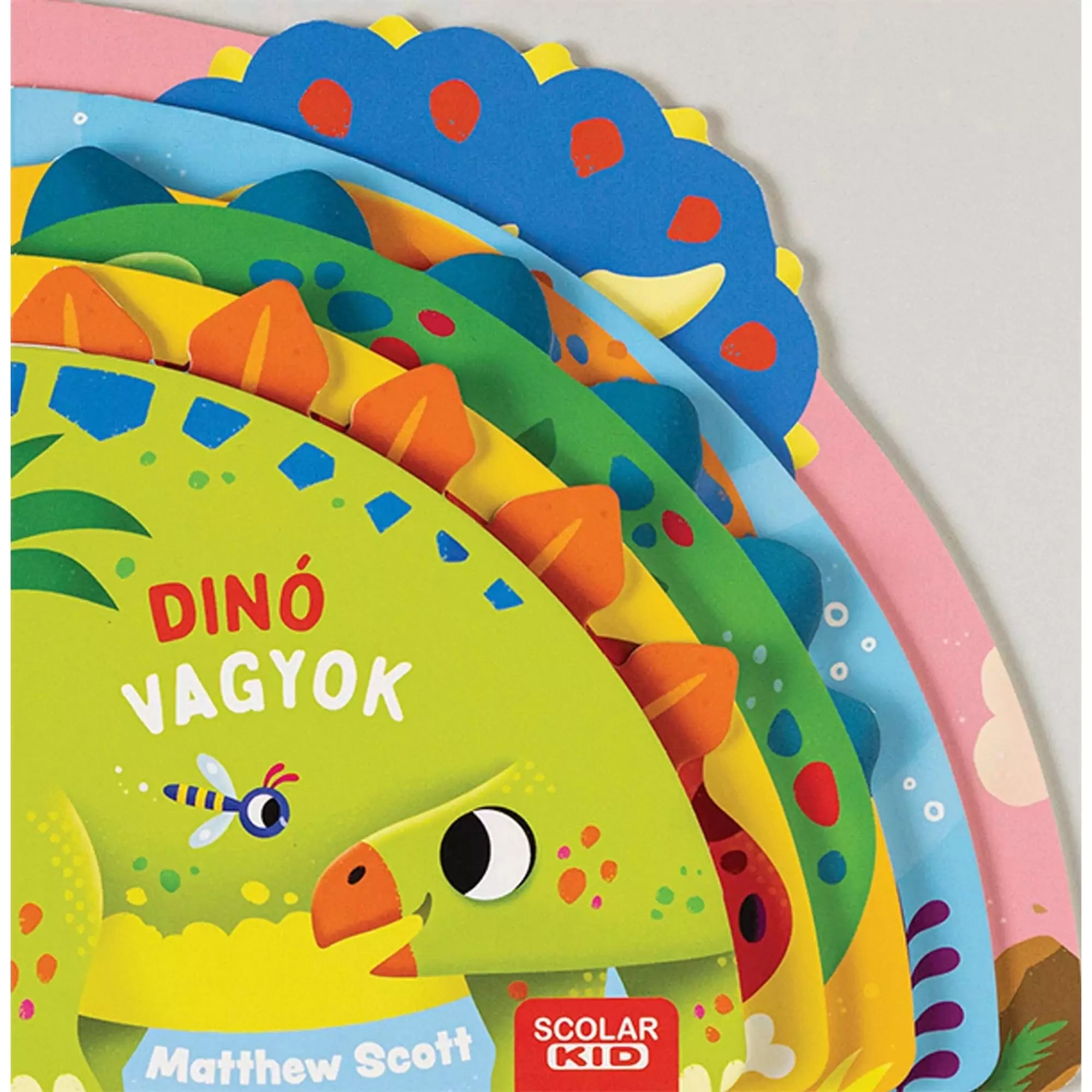  Színes, félkör alakú, magyar nyelvű gyerekkönyv borítója „Dinó vagyok” címmel, különböző dinoszauruszok fejeit ábrázoló oldalrétegekkel, Scolar KID kiadásban.