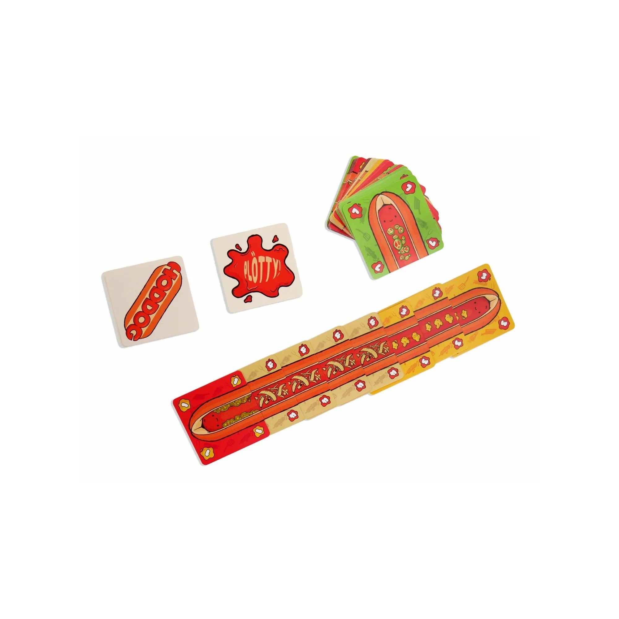 A Hoddog társasjáték színes kártyái játék közbeni elrendezésben, a középen “Hotty” és “Hoddog” feliratú lapokkal.