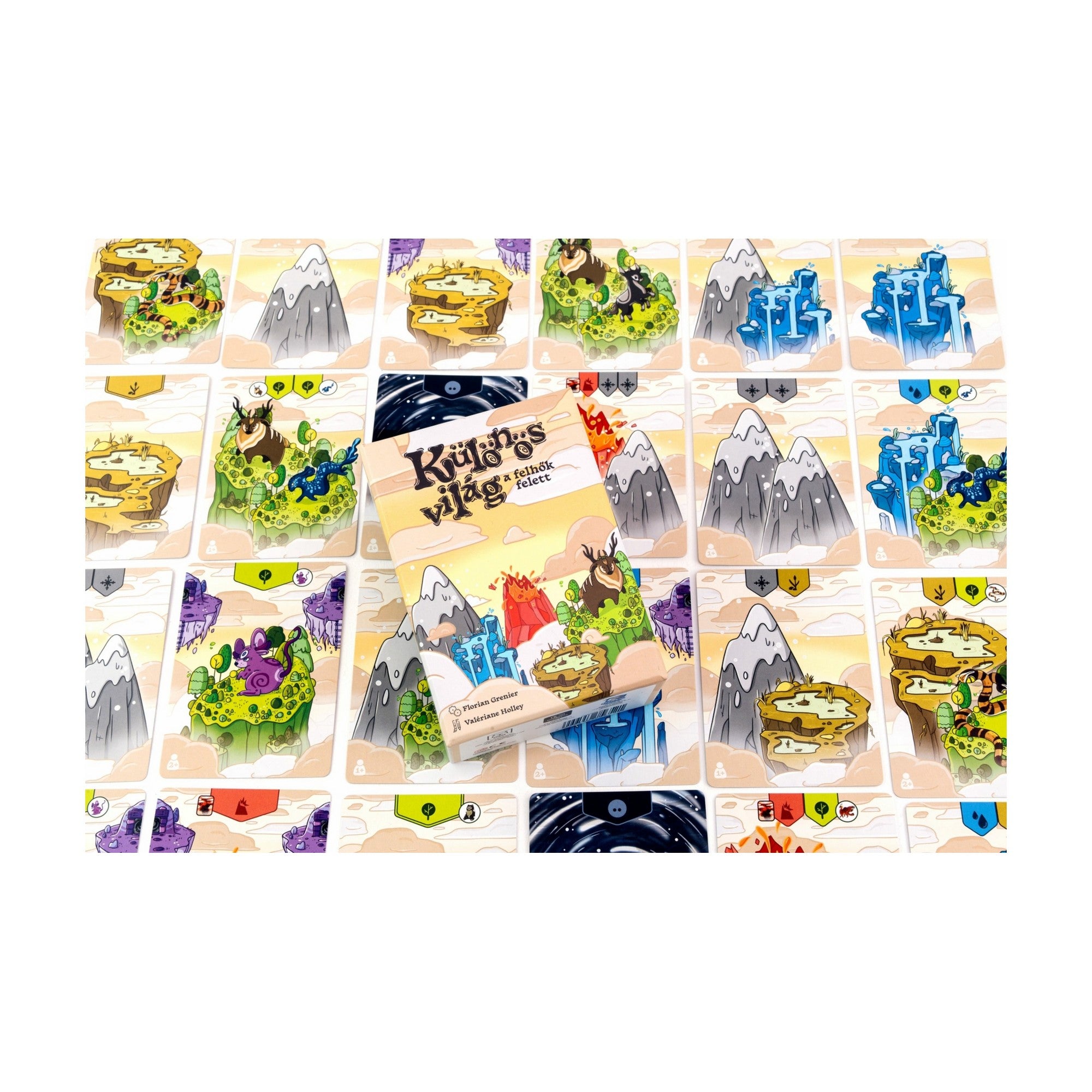 A Különös világ – A felhők felett doboza elhelyezve az elkészült, lebegő szigetekből épült világon. A színes, részletes kártyák és a játék dizájnja vizuálisan is lenyűgöző.