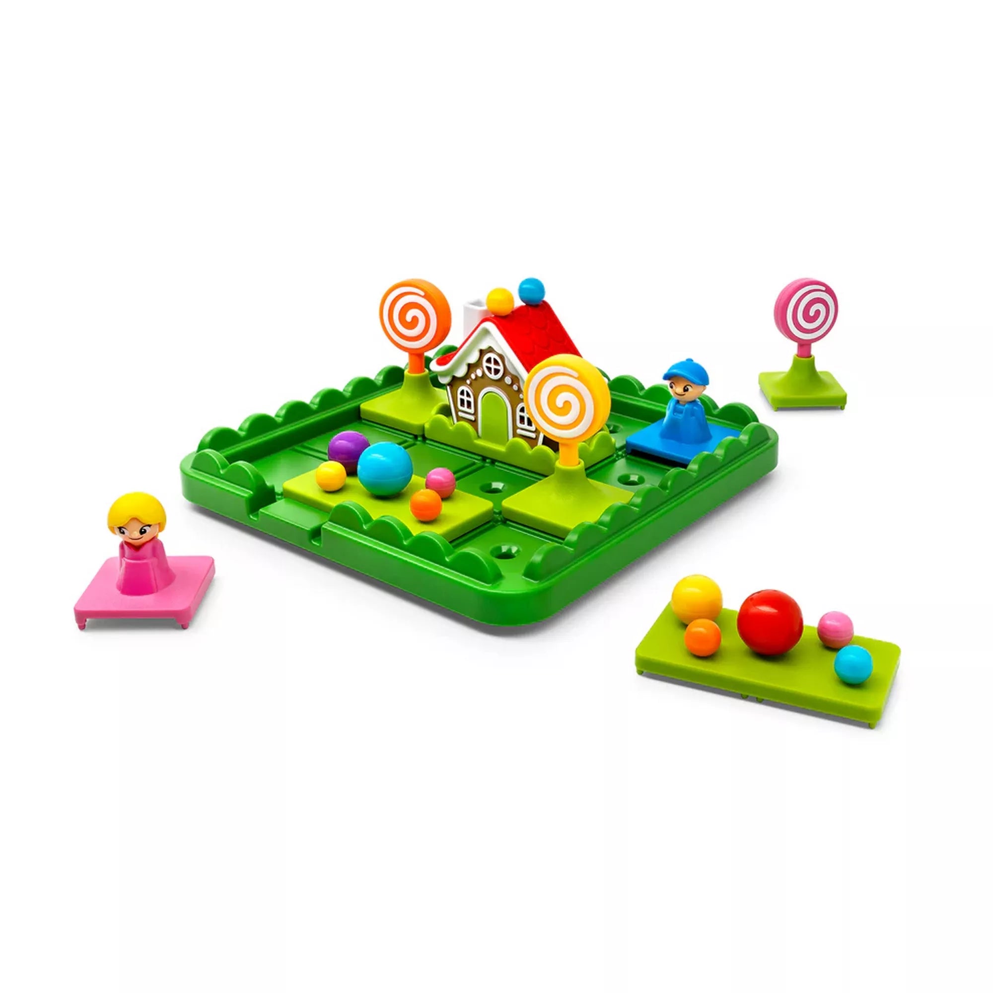 „A Hansel & Gretel Deluxe játéktábla mézeskalácsházzal, figurákkal és színes cukorkaelemekkel, szétszedett elemekkel körülvéve.”